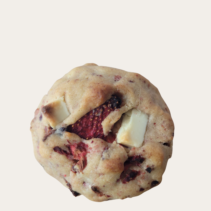 “Strawberry shortcake NYC-style gourmet cookie with white chocolate chunks and visible strawberry pieces”